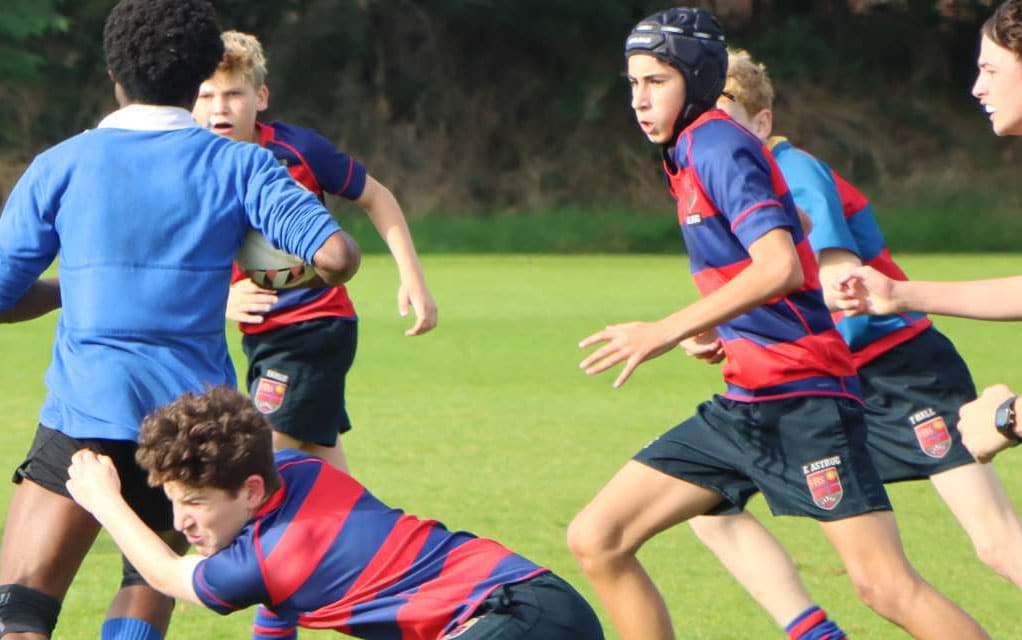 Children from Fulham Boys School playing rugby