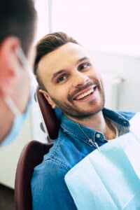 Young man smiling at his dentist