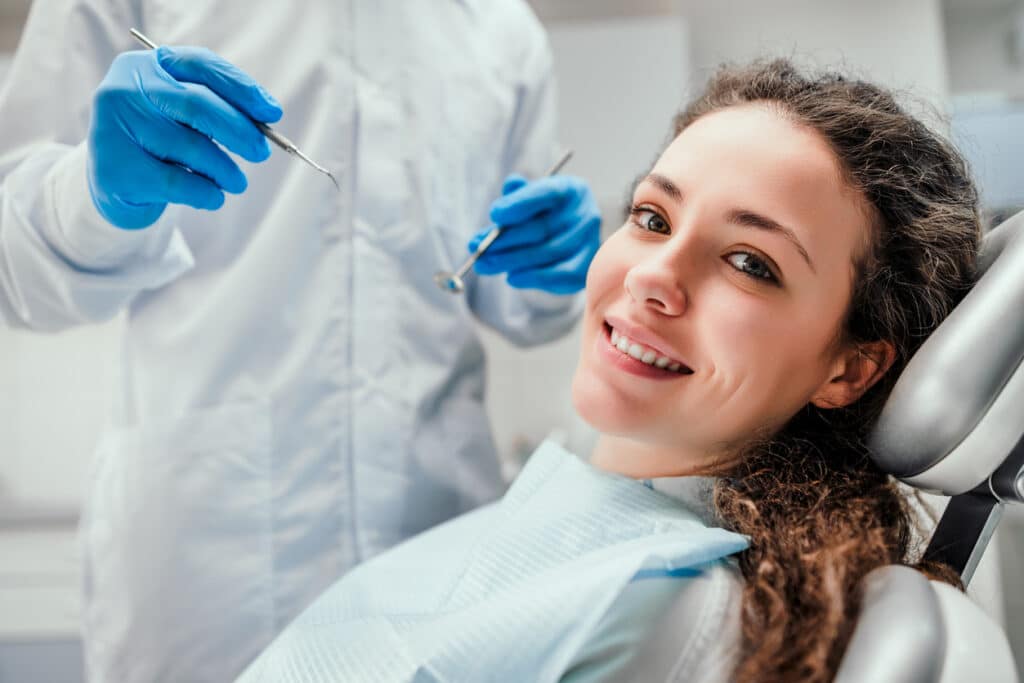 Fulham dentist young woman receiving dental treatment